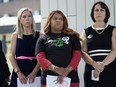 Amanda Zurawski, who developed sepsis and nearly died after being refused an abortion when her water broke at 18 weeks, left, and Samantha Casiano, who was forced to carry a nonviable pregnancy to term and give birth to a baby who died four hours after birth, center, stand with their attorney Molly Duane outside the Travis County Courthouse, Wednesday, July 19, 2023, in Austin, Texas.