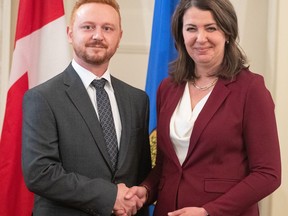Alberta Justice Minister Mickey Amery and Premier Danielle Smith during the swearing in of her cabinet, in Edmonton, June 9, 2023.