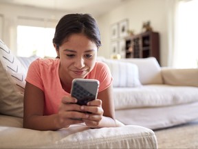 Girl using a cellphone.