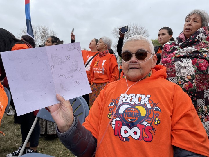  Dorah Montgrande holds one of the birthday cards given to her after the Rock Your Roots Walk for Reconciliation on Saturday.