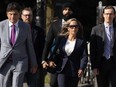Tamara Lich walks with lawyer Lawrence Greenspan (left) as they make their way to the courthouse on the first day of trial, in Ottawa, Tuesday, Sept. 5, 2023.