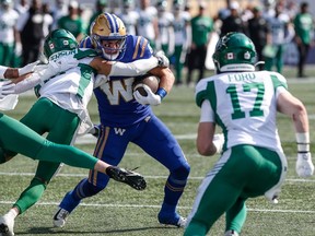 Winnipeg Blue Bombers' Dalton Schoen (83) runs for the first down against the Saskatchewan Roughriders during the first half of CFL football action in Winnipeg Saturday, September 9, 2023.