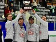 Left to right: Trent Knapp, Mike Armstrong, Brennen Jones and Kelly Knapp celebrate after winning the Saskatchewan men's curling championship on Feb. 5, 2023 at Affinity Place in Estevan.