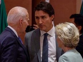 U.S. President Joe Biden, left, Canada's Prime Minister Justin Trudeau, centre, and European Commission President Ursula von der Leyen speak with eachother before the start of the second working session meeting of the G20 Leaders' Summit at Bharat Mandapam in New Delhi on Sept. 9, 2023.