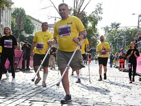 Ukrainian servicemen with limb loss take part in a half marathon in the western Ukrainian city of Lviv on September 3, 2023.