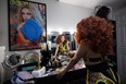 Filipino drag queen Amy Grant gets ready at her makeup table in her Saskatoon home.