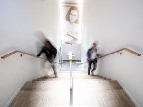 People walk up the stairs at the renovated Anne Frank House Museum in Amsterdam, Netherlands, Wednesday, Nov. 21, 2018.