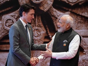 India's Prime Minister Narendra Modi shakes hand with Canada's Prime Minister Justin Trudeau ahead of the G20 Leaders' Summit in New Delhi on Sept. 9, 2023.