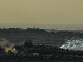 An Israeli tank operates in the Gaza Strip, as seen from southern Israel, Monday, Oct. 30, 2023.