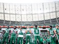 Saskatchewan Roughriders listen to the National Anthem before the game at Mosaic Stadium on Oct. 21, 2023 in Regina.