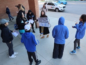 Shagla McKay (with sign) smudges supporters during a break in the trial of Taylor Ashley Kennedy, 29. Kennedy is charged with impaired driving in the Sept. 9, 2021 death of nine-year-old Baeleigh Maurice.
