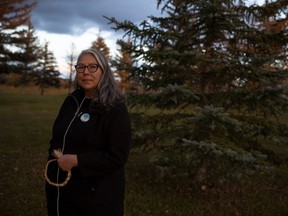Advocate Lori Whiteman, who helped tailor the Missing and Murdered Indigenous Women and Girls+ Community Response Fund criteria, stands at the Place of Reflection near the RCMP Heritage Centre on Oct. 4, 2023 in Regina.