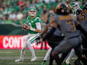 Quarterback Jake Dolegala throws a pass during a CFL game featuring the Saskatchewan Roughriders and Hamilton Tiger Cats in Regina on October 7, 2023.