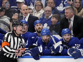 There's little debate NHL officials have one of the toughest jobs in professional sports. The game is fast and decisions have to be made in the blink of an eye. Referee Trevor Hanson (14) has a word with Toronto Maple Leafs head coach Sheldon Keefe, right, after a call against Leafs' Mark Giordano, in this Tuesday, May 2, 2023 file photo.