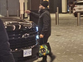 The Instgram post from wearecanadaproud shows Jagmeet Singh carrying a bag with a Versace logo.