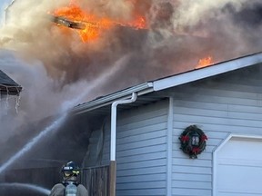 Firefighters battled blazes between two homes in Saskatoon's Silverwood Heights neighbourhood on the afternoon of Monday, November 13, 2023.