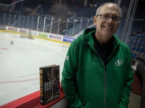 Sports writer Rob Vanstone with his new book Brave Face: Wild Tales of Hockey Goaltenders in the Era Before Masks at the Brandt Centre on Tuesday, November 14, 2023 in Regina.