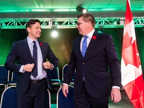 Conservative Party Leader Pierre Poilievre, left, and Saskatchewan Premier Scott Moe, right, stand on stage during Saskatchewan Party Convention in Regina on Saturday, November 4, 2023.