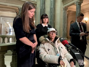 Opposition critic for social services and housing Meara Conway, left, stands with Evelyn Harper, a senior who was evicted from her unit in a Regina housing complex with no aid from social services, and her care aide at the Saskatchewan legislature on Nov. 1, 2023.