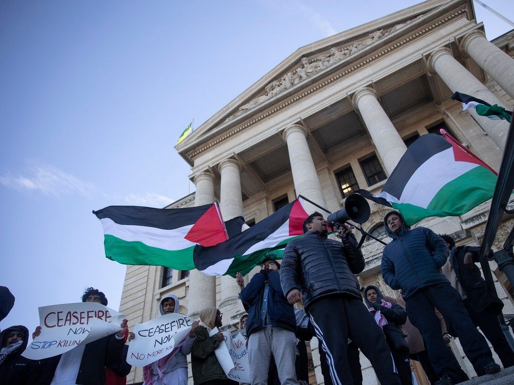A group of Palestinian supporters rally outside of the Saskatchewan Legislative Building after being removed for disturbing proceedings on Monday, November 20, 2023 in Regina. KAYLE NEIS / Regina Leader-Post