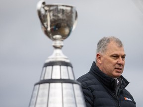 CFL Commissioner Randy Ambrosie speaks beside the Grey Cup at Bayfront Park during the CFL's Grey Cup week in Hamilton, Tuesday, December 7, 2021.