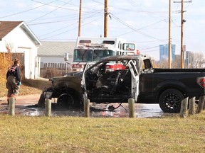 A 2014 Ford F-150 pickup truck was gutted by fire at around noon Wednesday, Oct. 18, 2023. It was parked in a back alley behind homes in the 2000 block of 17th Street West at Avenue U South, on the north end of Fred Mendel Park. Yhe blaze was quickly extinguished by the Saskatoon Fire Department. Black smoke could be seen rising in the air from 1.5 kilometres away. Police vehicles were parked nearby, while a search for a possible arson suspect was carried out. ROB O'FLANAGAN/Saskatoon StarPhoenix