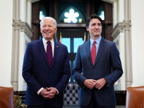 Prime Minister Justin Trudeau and U.S. President Joe Biden take part in a meeting on Parliament Hill, in Ottawa, Friday, March 24, 2023.
