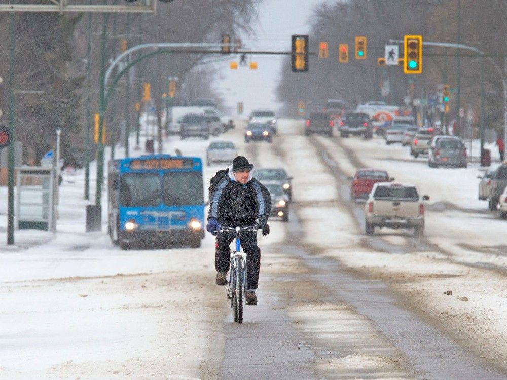 A cyclist rides east down 20th Street West in March of 2016