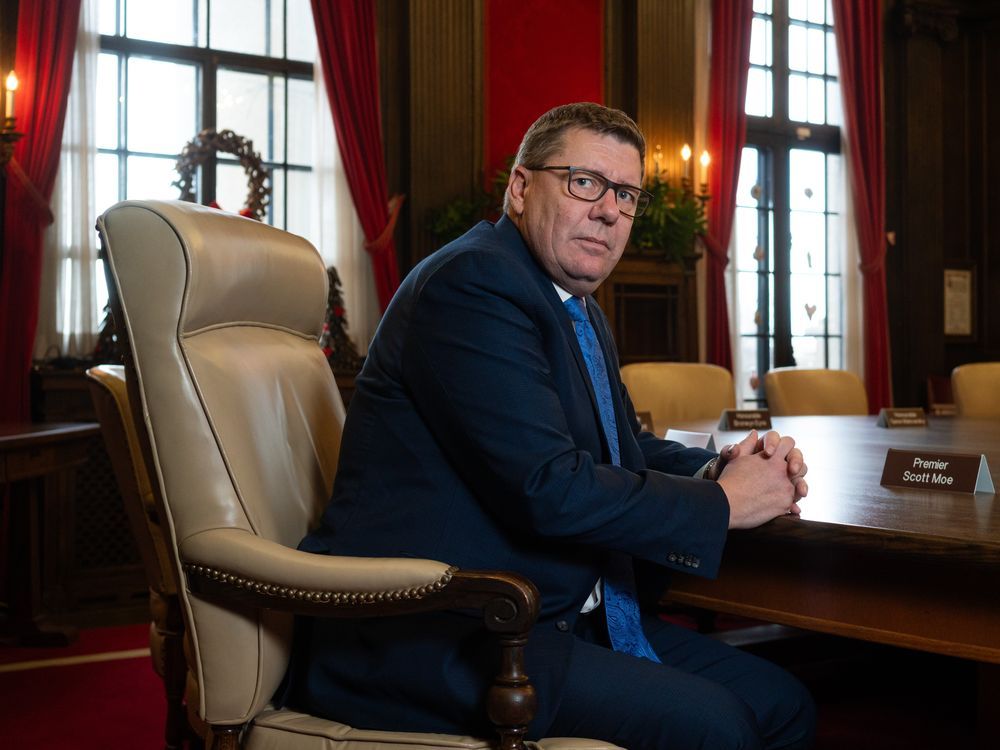 Saskatchewan Premier Scott Moe sits for a photograph in the cabinet room at the Saskatchewan Legislative Building in Regina, on Monday, Dec. 18, 2023.