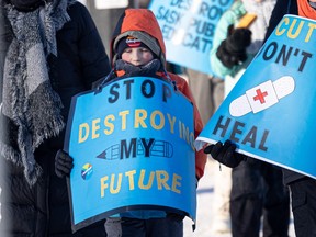 Child with sign on picket line