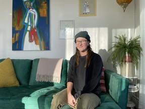 Sylvie Walker, a Fransaskois artist and musician, sits for a photo at her home in Saskatoon, Saskatchewan in December 2023