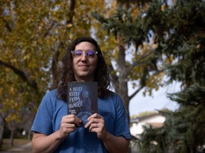 Regina-born author Spenser Smith recently published his first book of poetry (A Brief Relief from Hunger) to challenge the stigmas faced by drug users. Smith is shown at a park in his old neighbourhood of Uplands on Oct. 6, 2023 in Regina.
