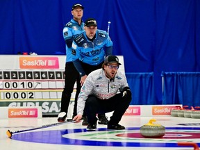 Brennen Jones (front) calls the line for Regina skip Kelly Knapp during the final at the 2023 SaskTel Saskatchewan Tankard men's curling championship in Estevan.