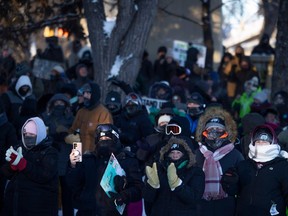 Saskatchewan Teachers' Federation members and supporters cheer on a speaker outside Albert Memorial Bridge during a provincial teachers strike on Tuesday, January 16, 2024 in Regina.