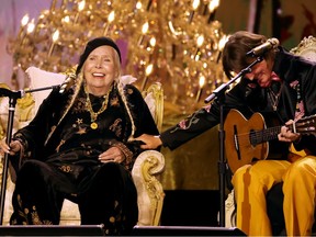 Joni Mitchell (left) and Brandi Carlile perform on stage during the 66th annual Grammy Awards at Crypto.com Arena on February 04, 2024 in Los Angeles, California.