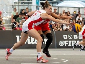 Team Canada's Paige Crozon (7) battles Team Chile's (7) for a loose ball during the 2023 FIBA 3X3 Women's Series at ICE District Fan Park in downtown Edmonton, Sunday July 30, 2023. Canada won 22 to 9. Photo by David Bloom