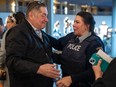 RCMP Constable Heidi Marshall, right, hugs and speaks with Darryl Burns, whose sister Gloria was one of the people killed on James Smith Cree Nation, following the second day of the inquest into the apprehension and death of Myles Sanderson. Marshall was the RCMP officer who ultimately drove into Sanderson's stolen vehicle during the high-speed chase, pushing him off the road.