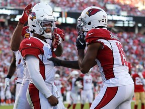 Arizona Cardinals quarterback Kyler Murray, left, is congratulated by Arizona Cardinals wide receiver KeeSean Johnson after scoring against the San Francisco 49ers during the second half of an NFL football game in Santa Clara, Calif., Sunday, Nov. 17, 2019.