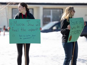 Students from Holy Cross, Walter Murray and Asquith rallied together on Taylor Street and in front of the STF building on Arlington chanting "We want Hoopla!". Photo taken in Saskatoon, Sask. on Monday, March 18, 2024.