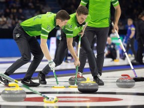 Lead Daniel Marsh (L) and second Kevin Marsh (R) sweep the ice as Team Saskatchewan takes on Team Prince Edward Island in Pool B action to open the 2024 Montana's Brier inside the Brandt Centre on Friday, March 1, 2024 in Regina.