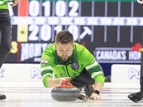 Skip Mike McEwen pushes the rock down the ice as Team Saskatchewan takes on Team Prince Edward Island in Pool B action to open the 2024 Montana's Brier inside the Brandt Centre on Friday, March 1, 2024 in Regina.