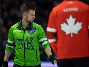Team Saskatchewan skip Mike McEwen walks past Team Canada skip Brad Gushue during the gold medal game at the 2024 Montana's Brier at the Brandt Centre on Sunday, March 10, 2024 in Regina.