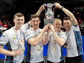 Team Scotland holds the trophy after defeating Canada 9-3 at the 2023 World Men's Curling Championship.