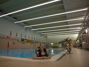 Lauren Demyen, last year's recipient of the Saskatchewan Underwater Council's scuba diving scholarship, demonstrates her gear at the U of R Kinesiology building pool on Friday, March 8, 2024 in Regina.