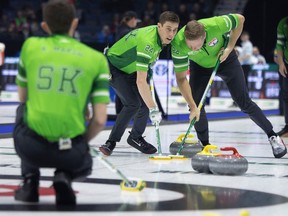 Team Sask lead Daniel Marsh sweeps beside third Colton Flasch during pool B action at the 2024 Montana's Brier inside the Brandt Centre on Tuesday, March 5, 2024 in Regina.