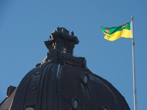 The Saskatchewan flag flutters in the wind atop the province's legislative building on a winter's day in Regina.