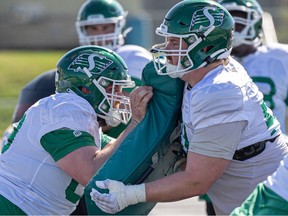 Saskatchewan Roughriders' offensive lineman Peter Godber (right) during training camp in Saskatoon at Griffith's Stadium in 2023.