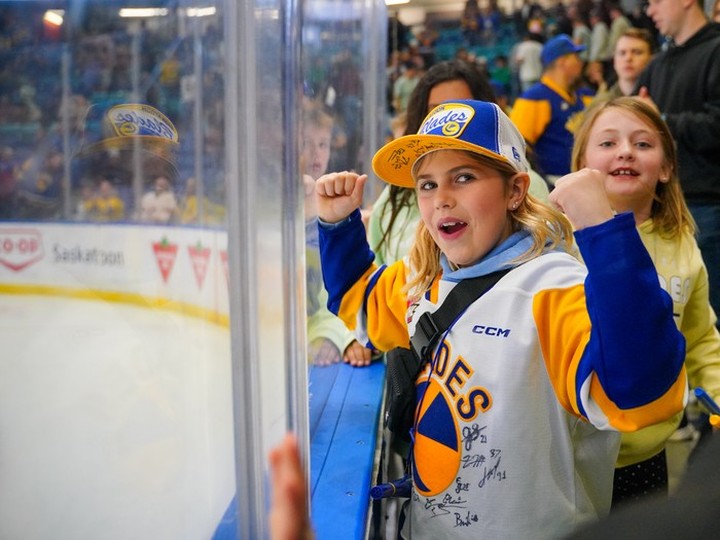  Fans cheer during the third period of WHL playoffs hockey action in Saskatoon on Friday.