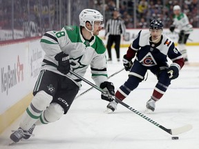 Sam Steel #18 of the Dallas Stars brings the puck off the boards against the Colorado Avalanche during the second period at Ball Arena on April 07, 2024 in Denver, Colorado.