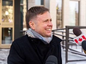 Bennett Jensen, legal director at LGBTQ+ lobby group Egale Canada, speaks to members of the media outside of the Court of King's Bench regarding legal action against Saskatchewan Government's pronoun consent policy in Regina on Wednesday, January 10, 2024.